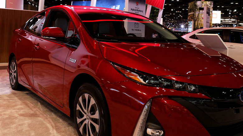 red Prius Prime at a car show