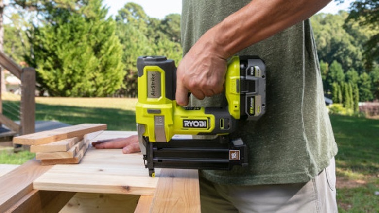 Nailing wood with 18-Volt ONE+ AirStrike 18-Gauge Cordless Brad Nailer