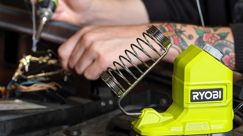 Man using the 18V ONE+ 120W Soldering Iron