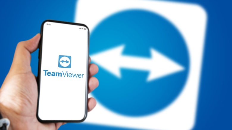 TeamViewer logo on a phone, in background