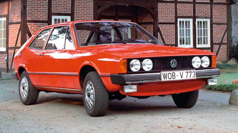 VW Scirocco by rural house