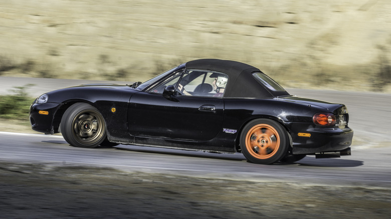 Mazda Miata drifts on track