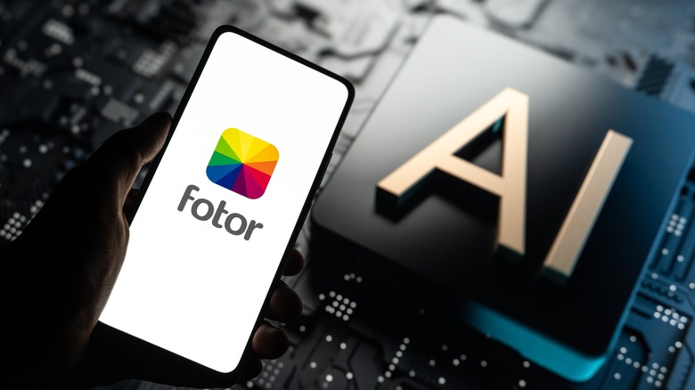 Fotor AI logo on phone screen