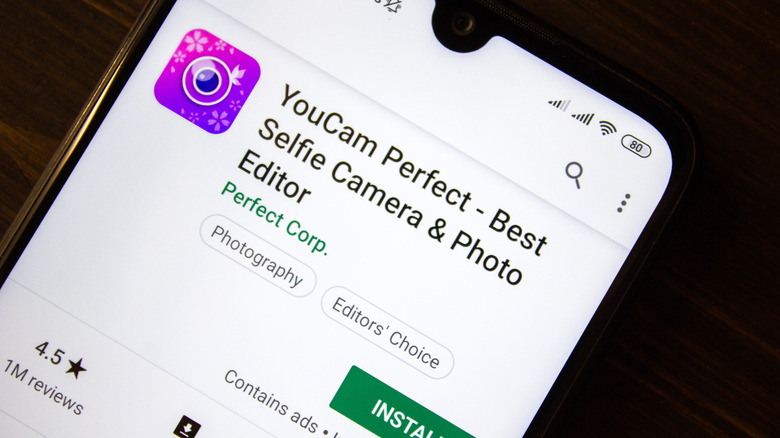 Youcam Perfect - Best Selfie Camera and Photo editor app on the display of smartphone