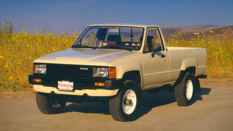 Beige 1985 Toyota Pickup/Hilux Fourth-Gen pickup truck front 3/4 view