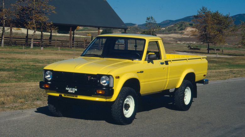 Yellow 1979 Toyota Pickup/Hilux Third-Gen front 3/4 view