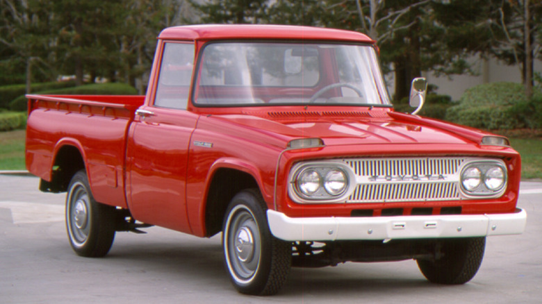 Red 1965 Toyota Stout compact pickup truck front 3/4 view