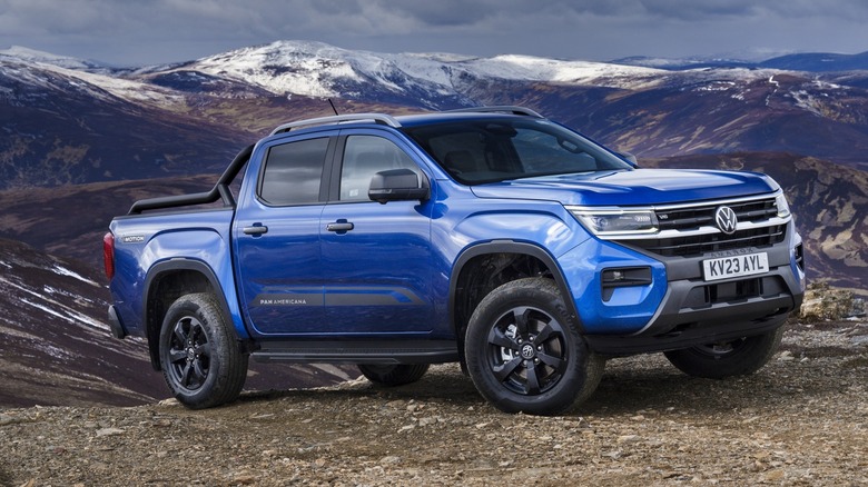 Blue 2023 Volkswagen Amarok parked in mountains