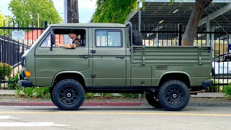 Olive green Volkswagen Transporter T3 Syncro pickup parked