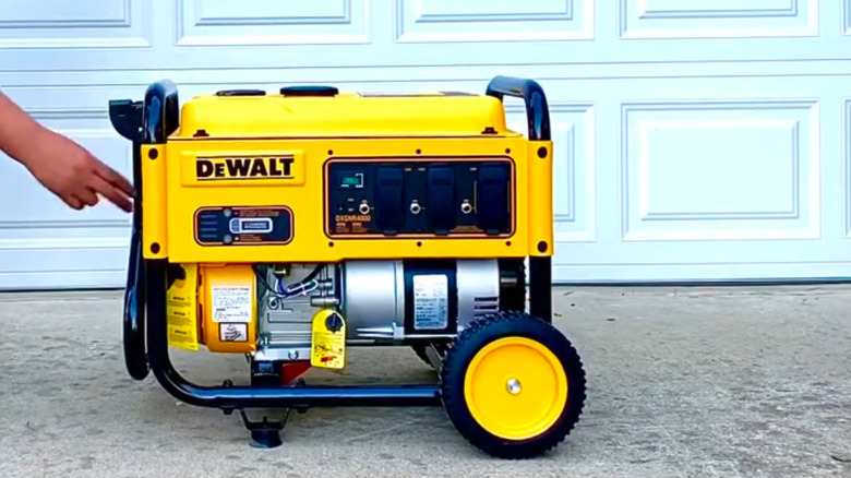 A portable generator in a driveway