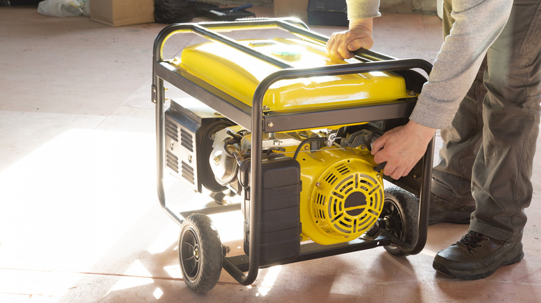 Person handling a portable generator