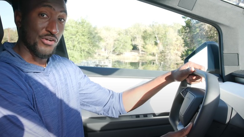 marques brownlee holding steering wheel