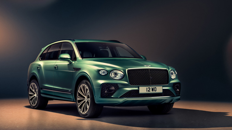 Green Bentley Bentayga studio shot front 3/4