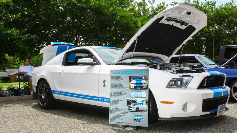 A 2011 Shelby GT500 with blue racing stripes