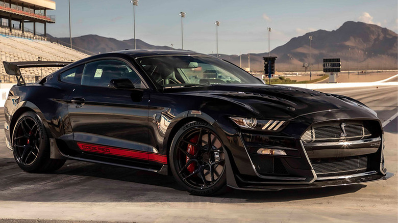 A Shelby GT500 Code Red on a race track