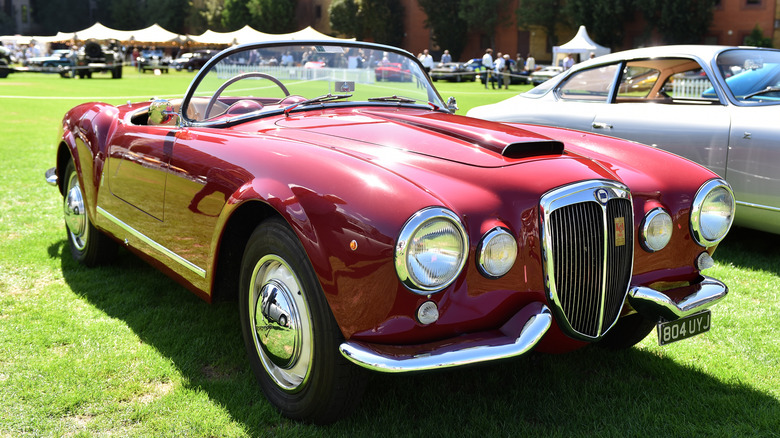 Red Lancia Aurelia B24 Spider convertible front 3/4