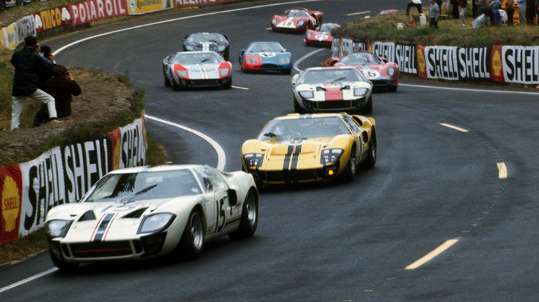 Three Ford GT40s lead the way through the Esses early in the 1966 Le Mans race