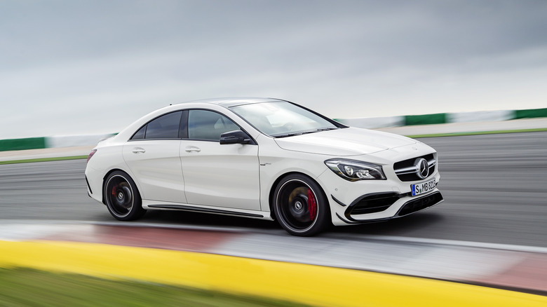 First-gen Mercedes-Benz CLA 45 S AMG cornering at speed on track