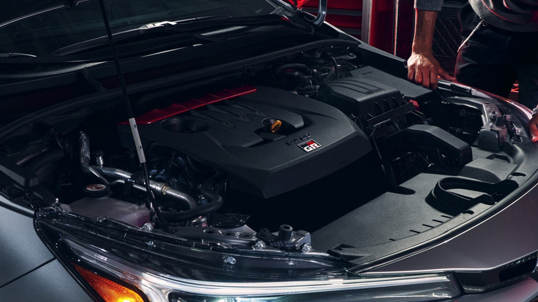 Toyota GR Corolla with an open hood showcasing G16E-GTS engine