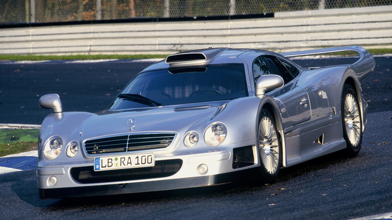 Silver metallic Mercedes-Benz CLK GTR Straßenversion driving on track