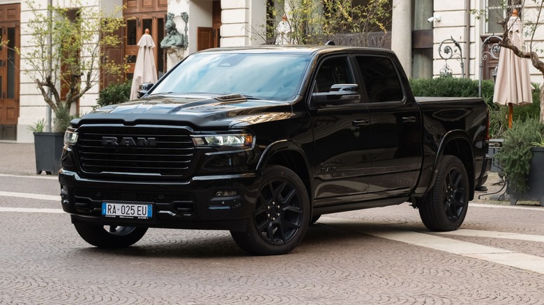 Black Dodge Ram 1500 parked in front of building