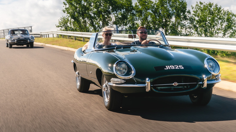 Two Jaguar E-Types driving on road