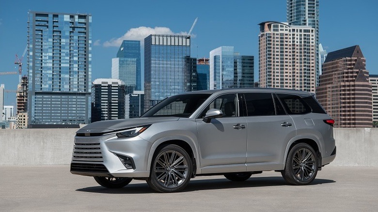 2024 Lexus TX front 3/4 view in front of cityscape