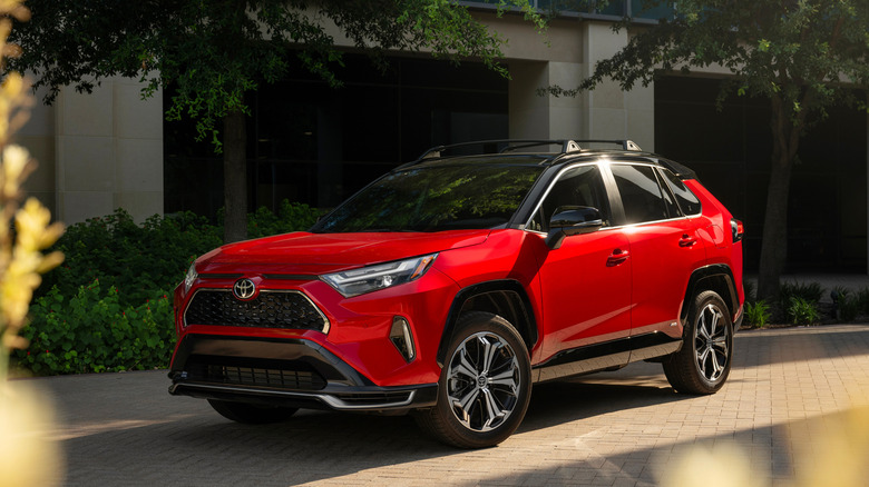 2025 Toyota RAV4 PHEV supersonic red front 3/4 view