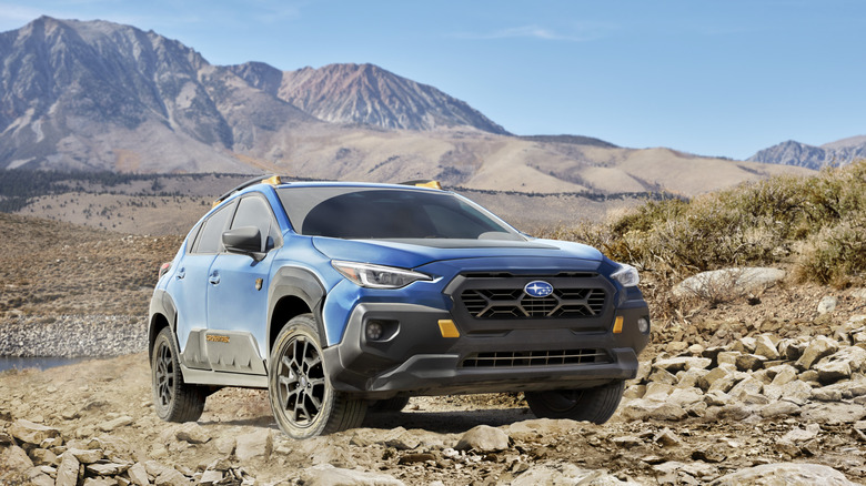 2024 Subaru Crosstrek Wilderness parked on a rocky surface front 3/4 view