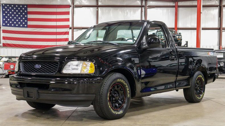 A 1998 Ford F-150 NASCAR Edition in a garage