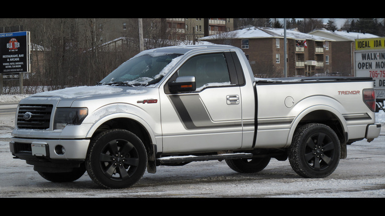 A silver 2014 Ford F-150 Tremor on a snowy day