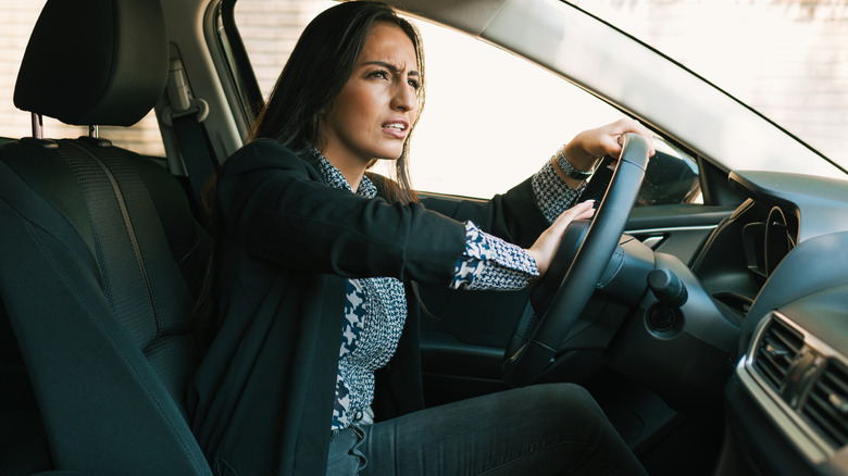 Woman honking her car horn