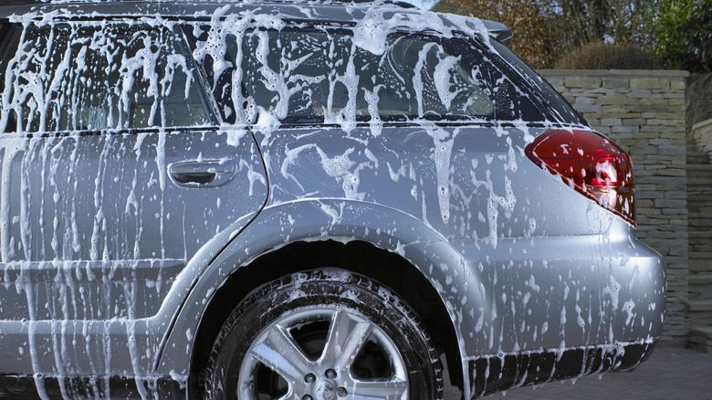 Car covered in soapy suds