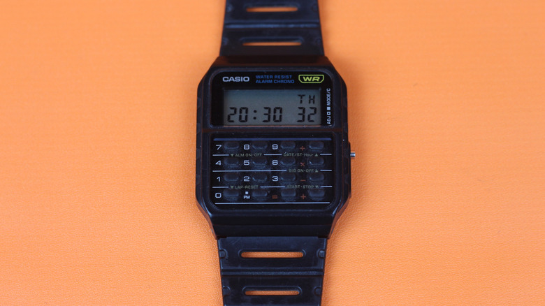 casio calculator watch Orange background