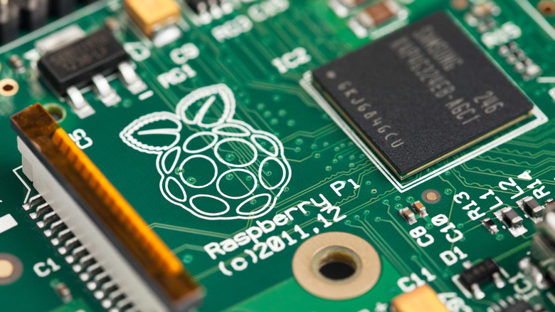 A close-up image of the Raspberry Pi logo on the circuit board