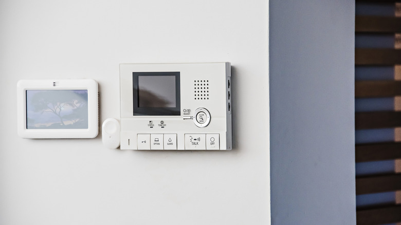 A home security system mounted on a wall