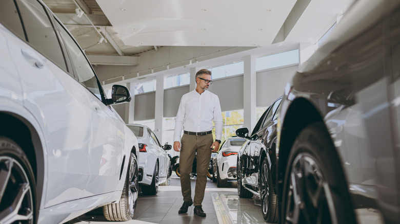 buyer walking alone in dealership