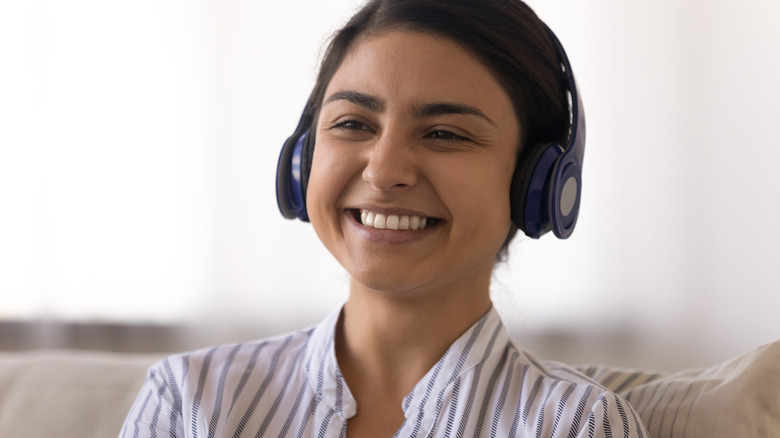 Girl wearing Bluetooth headphones