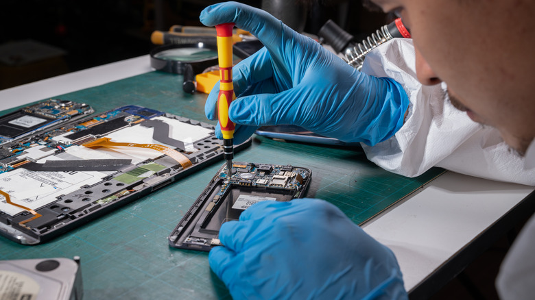 Man fixing electronic device