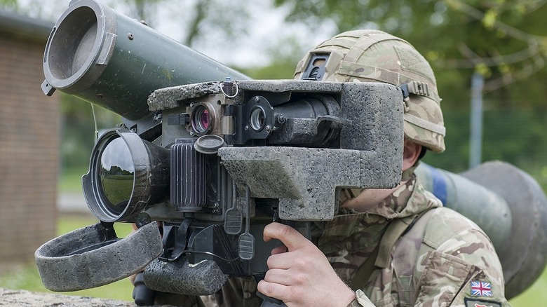 soldier aiming a javelin missile