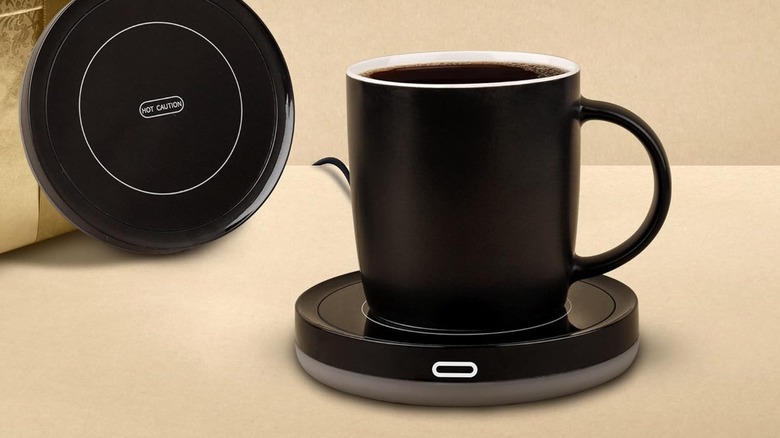 Mug full of coffee on top of BESTINNKITS Smart Coffee Warmer