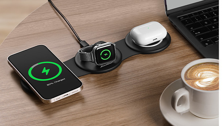 iPhone, Apple Watch, and AirPods charging on wireless pad