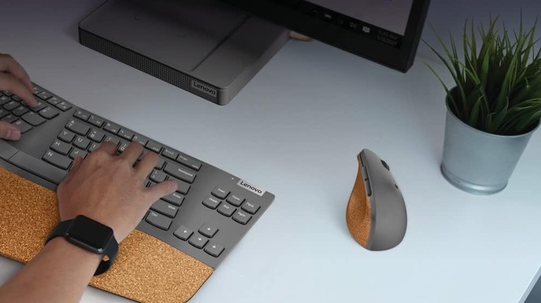 Lenovo vertical mouse on a desk with keyboard