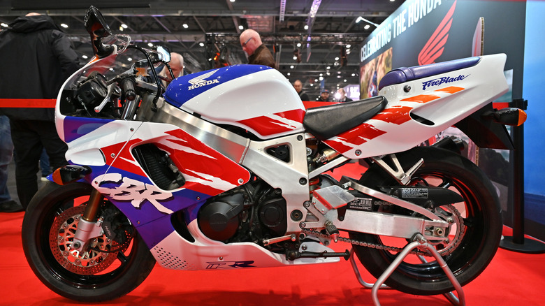 red white and blue Honda CBR900RR Fireblade in a showroom