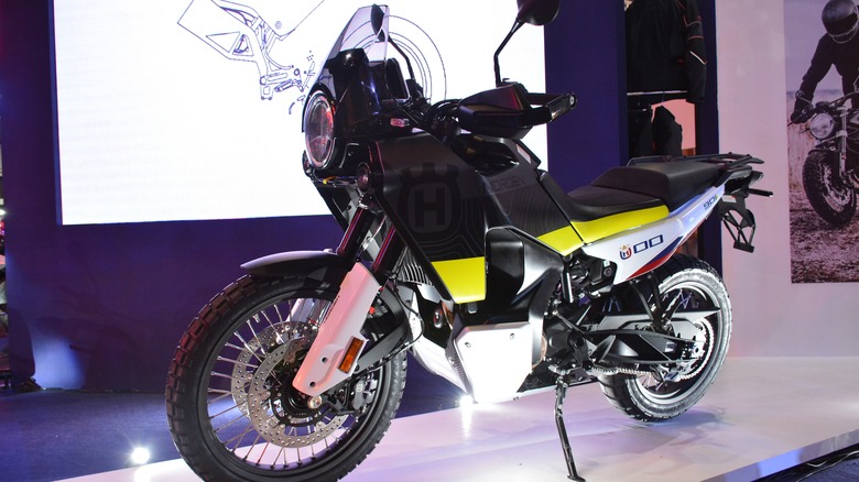 black and yellow Husqvarna Norden 901 parked in a showroom