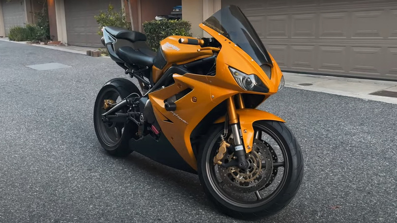 orange and black Triumph Daytona 675