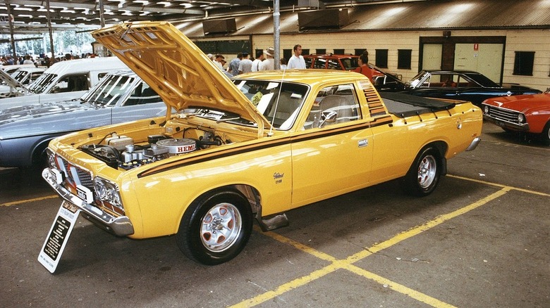 Yellow Chrysler Valiant Ute at a car show