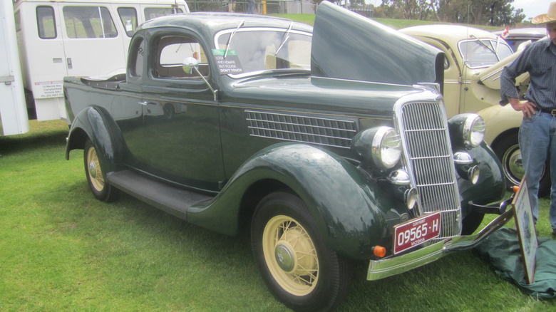 green 1935 ford coupe ute vehicle at car show