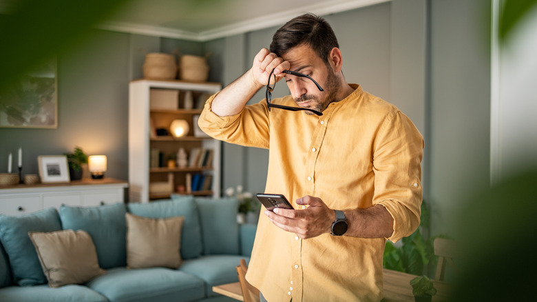 tired guy on phone