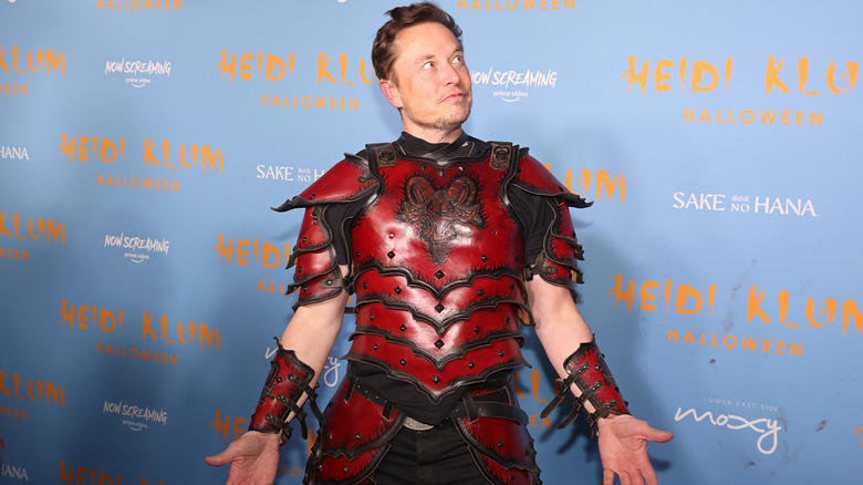 Elon Musk posing at a Halloween event.